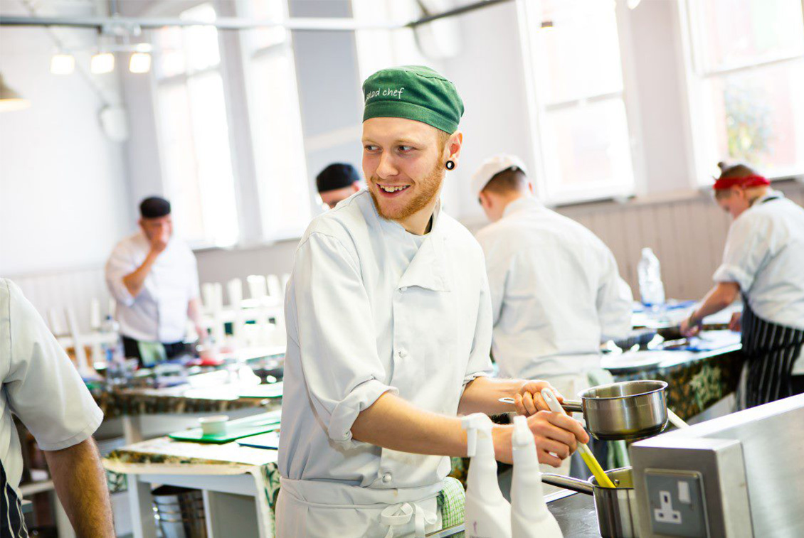 Young male chef in a kitchen